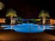Illuminated resort-style pool at night at 251 Silver Maple Rd, Groveland, FL 34736