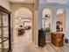 Open concept living space with archways and views into kitchen and Gathering room at 251 Silver Maple Rd, Groveland, FL 34736