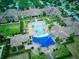 Community pool with surrounding buildings and landscaping at 251 Silver Maple Rd, Groveland, FL 34736