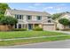 Two-story house with a brick facade, attached garage, and well-maintained lawn at 4436 Yachtmans Ct, Orlando, FL 32812