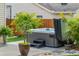 Relaxing hot tub surrounded by tropical plants on a patio at 4436 Yachtmans Ct, Orlando, FL 32812