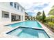 Luxury pool and spa with patio furniture at 1136 Castle Pines Ct, Reunion, FL 34747