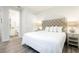 King-size bed, en-suite bathroom, and stylish decor at 1136 Castle Pines Ct, Reunion, FL 34747