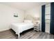 Bright bedroom with a queen-size bed and gray headboard at 1136 Castle Pines Ct, Reunion, FL 34747