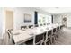 Large dining room table with seating for 12, perfect for entertaining at 1136 Castle Pines Ct, Reunion, FL 34747