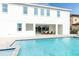 Stunning pool area with outdoor kitchen and seating at 1136 Castle Pines Ct, Reunion, FL 34747