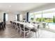 Bright dining room with large table and pool view at 1136 Castle Pines Ct, Reunion, FL 34747