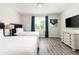Bright bedroom with two twin beds and a dresser at 1136 Castle Pines Ct, Reunion, FL 34747