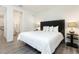 King bedroom with en-suite bathroom access at 1136 Castle Pines Ct, Reunion, FL 34747