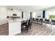 Modern kitchen with granite countertops and breakfast bar at 1136 Castle Pines Ct, Reunion, FL 34747