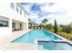 Resort-style pool and spa with patio furniture at 1136 Castle Pines Ct, Reunion, FL 34747