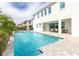 Inviting pool with patio and outdoor dining area at 1136 Castle Pines Ct, Reunion, FL 34747
