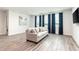 Living room with light-gray sofa and blue curtains at 1136 Castle Pines Ct, Reunion, FL 34747