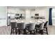 Modern kitchen with large island, stainless steel appliances, and granite countertops at 1136 Castle Pines Ct, Reunion, FL 34747