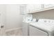 Bright laundry room with washer and dryer at 1136 Castle Pines Ct, Reunion, FL 34747