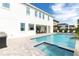 Luxury pool with spa and patio; outdoor kitchen at 1136 Castle Pines Ct, Reunion, FL 34747