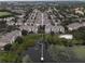 Aerial view of community near a large lake at 3446 Soho St # 304, Orlando, FL 32835