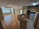 Kitchen with light wood cabinets, laminate countertops and tile floor at 3446 Soho St # 304, Orlando, FL 32835
