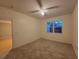 Bright bedroom with carpeted floor, ceiling fan, and window with blinds at 3446 Soho St # 304, Orlando, FL 32835