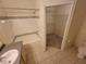 Bathroom features a tub, toilet, sink, and a spacious linen closet at 3446 Soho St # 304, Orlando, FL 32835