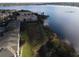 Aerial view showcasing lakefront property and community at 3446 Soho St # 304, Orlando, FL 32835