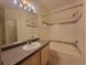 Bathroom with a tub, sink vanity, and large mirror at 3446 Soho St # 304, Orlando, FL 32835