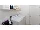 Laundry room with washer, dryer, and storage shelves at 3846 Cabo Rojo Dr, Saint Cloud, FL 34772