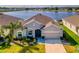 Single-story house with lake view and landscaped yard at 3846 Cabo Rojo Dr, Saint Cloud, FL 34772