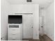 Bedroom with white dresser, closet, and access to a hallway at 3846 Cabo Rojo Dr, Saint Cloud, FL 34772