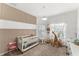 Bedroom with crib, changing station, and decorative wall at 3846 Cabo Rojo Dr, Saint Cloud, FL 34772