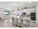 Modern kitchen with white cabinets, island, and double ovens at 3846 Cabo Rojo Dr, Saint Cloud, FL 34772