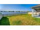 Backyard with lake view, patio, and white fence at 3846 Cabo Rojo Dr, Saint Cloud, FL 34772