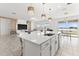 Open concept kitchen with island and lake views at 3846 Cabo Rojo Dr, Saint Cloud, FL 34772