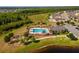 Aerial view of community pool, playground, and clubhouse at 3846 Cabo Rojo Dr, Saint Cloud, FL 34772