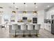 Modern kitchen with white cabinets, large island, and gold lighting at 3846 Cabo Rojo Dr, Saint Cloud, FL 34772