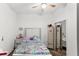 Bedroom with a queen bed, dresser, and mirrored closet at 3846 Cabo Rojo Dr, Saint Cloud, FL 34772