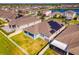Aerial view of house with solar panels and neighborhood at 3846 Cabo Rojo Dr, Saint Cloud, FL 34772