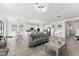 Open floor plan with kitchen and living area with gray sofas at 3846 Cabo Rojo Dr, Saint Cloud, FL 34772