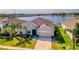 Single-story home with a two-car garage and lake view at 3846 Cabo Rojo Dr, Saint Cloud, FL 34772