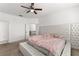 Main bedroom with plush bed, tufted headboard and en-suite bathroom at 3846 Cabo Rojo Dr, Saint Cloud, FL 34772