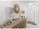 Inviting entryway with decorative console table and stylish lamps at 2862 Mosshire Cir, St Cloud, FL 34772