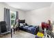 Cozy bedroom with twin bed, window, and ample natural light at 2862 Mosshire Cir, St Cloud, FL 34772
