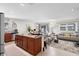 Open concept kitchen and living room with kitchen island and stainless steel appliances at 2862 Mosshire Cir, St Cloud, FL 34772