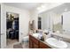 Bathroom with double vanity, walk-in shower and closet at 2862 Mosshire Cir, St Cloud, FL 34772