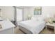 Cozy bedroom with a queen-size bed and large window at 2862 Mosshire Cir, St Cloud, FL 34772
