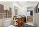 Clean bathroom with single vanity and view of bedroom at 2862 Mosshire Cir, St Cloud, FL 34772
