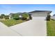 Beautiful curb appeal with a two-car garage and lush landscaping at 2862 Mosshire Cir, St Cloud, FL 34772
