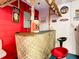 Fun tiki-themed basement bar with a custom-made wood bar top and fun decor at 114 Castlemain Cir, Davenport, FL 33897