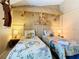 Themed bedroom with twin beds and safari decor at 114 Castlemain Cir, Davenport, FL 33897