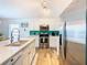 Modern kitchen with stainless steel appliances and white cabinetry at 114 Castlemain Cir, Davenport, FL 33897
